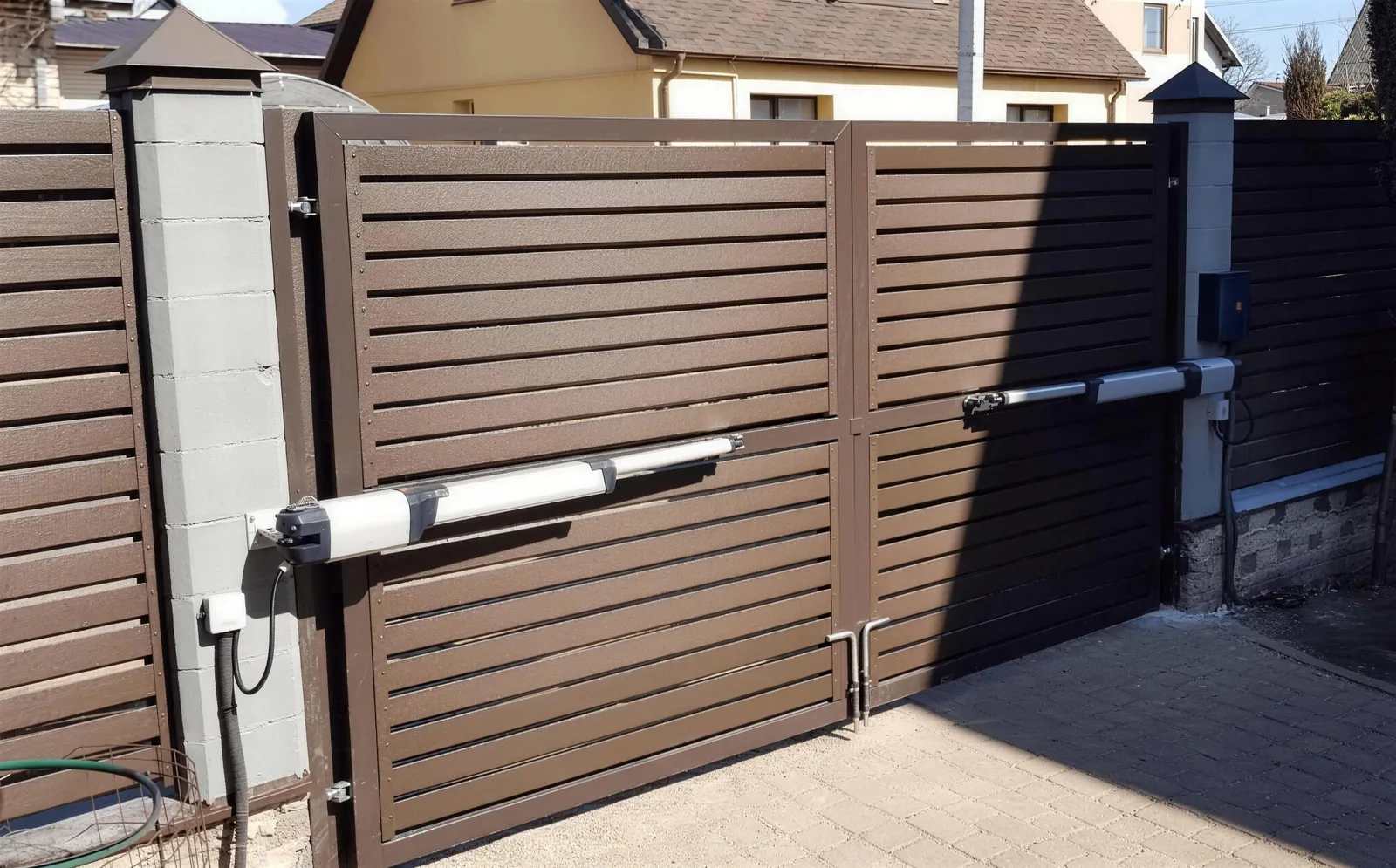 Automated double swing gates with ram openers and control box
